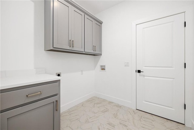 17 Winters Dr, Bella Vista, AR 72714 - laundry room featuring hookup for an electric dryer, cabinet space, hookup for a washing machine, baseboards, and light marble finish flooring
