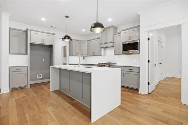17 Winters Dr, Bella Vista, AR 72714 - kitchen featuring gray cabinets, stainless steel microwave, a sink, tasteful backsplash, and recessed lighting