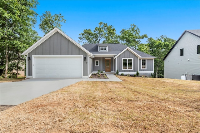 17 Winters Dr, Bella Vista, AR 72714 - view of front of property featuring board and batten siding, a garage, driveway, a front yard, and roof with shingles