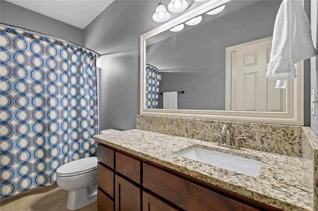 full bathroom with toilet, vanity, tile patterned floors, and a shower with shower curtain