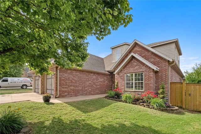 view of front of house featuring brick siding, driveway, a garage, and roof with shingles