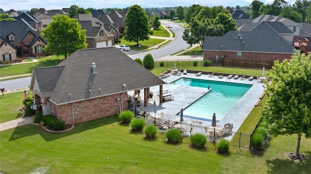 aerial view of residential area featuring a pool
