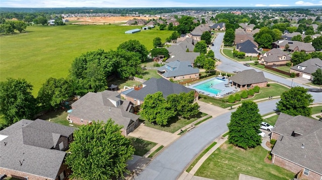 aerial view of residential area featuring a pool area