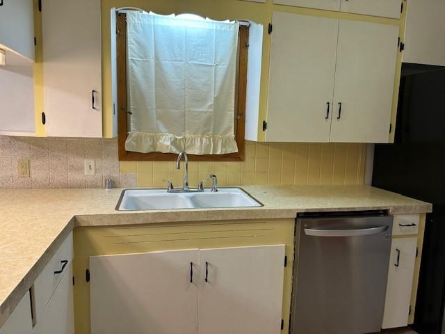 420 Natchez Trace Dr, Harrison, AR 72601 - kitchen featuring dishwasher, backsplash, light countertops, and white cabinets