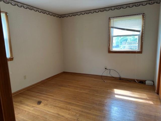 420 Natchez Trace St, Harrison, AR 72601 - spare room with light wood-style flooring and baseboards