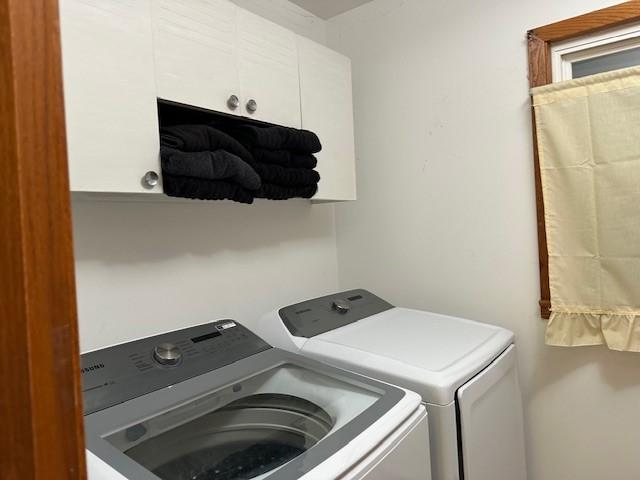 420 Natchez Trace Dr, Harrison, AR 72601 - laundry area featuring washer and clothes dryer and cabinet space