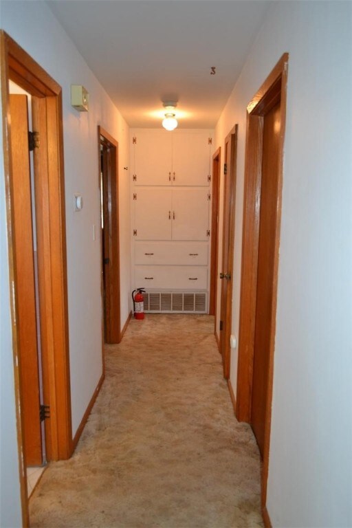 420 Natchez Trace Dr, Harrison, AR 72601 - corridor with baseboards and light colored carpet