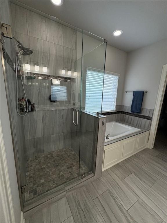 773 Via Firenze Ave, Tontitown, AR 72762 - full bath featuring a bath, a stall shower, and recessed lighting