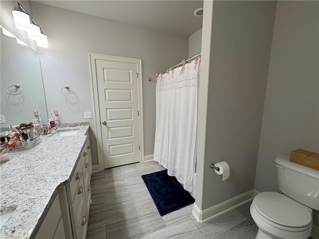 773 Via Firenze Ave, Tontitown, AR 72762 - bathroom featuring vanity, toilet, baseboards, and a shower with curtain