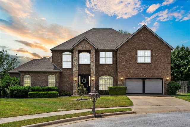 view of front of home with driveway, an attached garage, brick siding, and a shingled roof