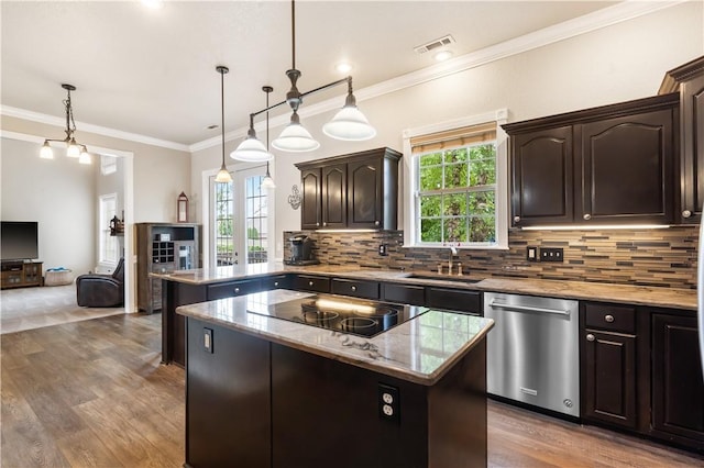 kitchen with dishwasher, black electric stovetop, a sink, healthy amount of natural light, and crown molding