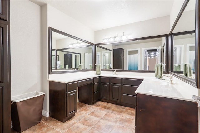 full bathroom with vanity and tile patterned flooring