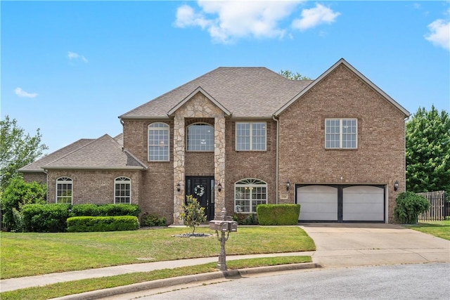 view of front of property with concrete driveway, a garage, brick siding, and roof with shingles