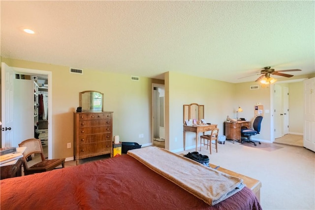 18880 Skylight Mountain Rd, Canehill, AR 72717 - carpeted bedroom featuring an office area, a textured ceiling, baseboards, a walk in closet, and a ceiling fan