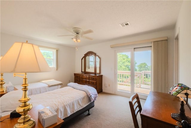 18880 Skylight Mountain Rd, Canehill, AR 72717 - bedroom with access to outside, multiple windows, carpet flooring, and a ceiling fan