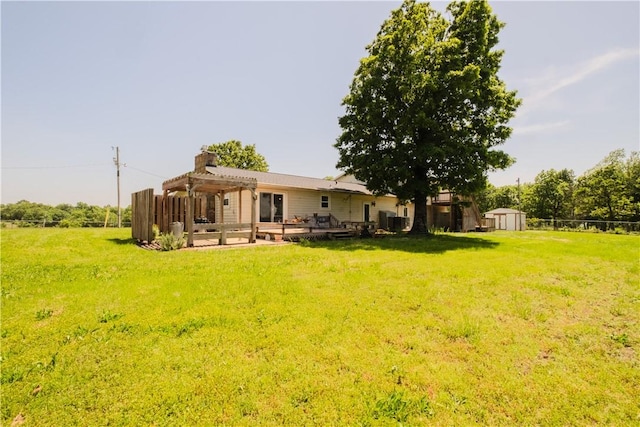 18880 Skylight Mountain Rd, Canehill, AR 72717 - view of grassy yard with a pergola, a storage shed, and an outdoor structure