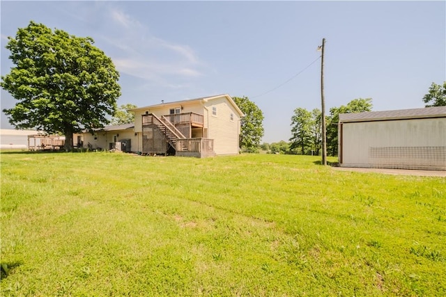 18880 Skylight Mountain Rd, Canehill, AR 72717 - view of grassy yard with stairway and a wooden deck