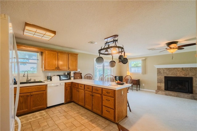 18880 Skylight Mountain Rd, Canehill, AR 72717 - kitchen with white dishwasher, a sink, a peninsula, a ceiling fan, and ornamental molding