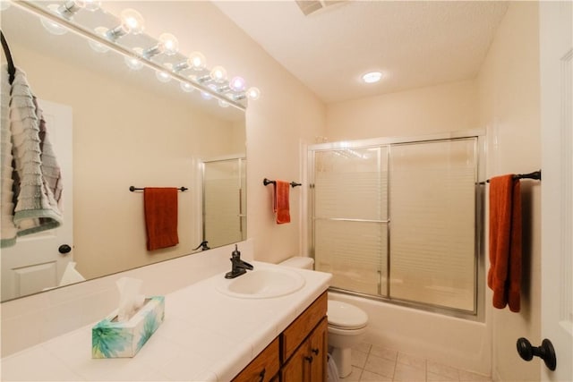 18880 Skylight Mountain Rd, Canehill, AR 72717 - full bathroom featuring toilet, vanity, tile patterned floors, and shower / bath combination with glass door