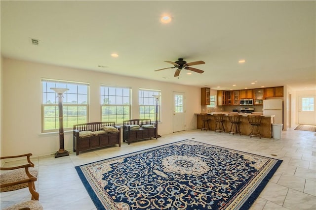 18880 Skylight Mountain Rd, Canehill, AR 72717 - living room with healthy amount of natural light, recessed lighting, a ceiling fan, and baseboards