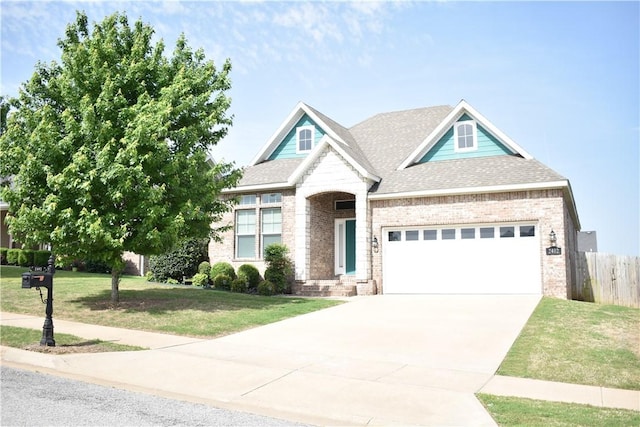 2402 N Brook Ln, Siloam Springs, AR 72761 - view of front of property featuring brick siding, driveway, a garage, and roof with shingles