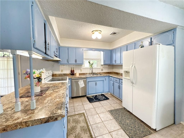505 10th St, Bentonville, AR 72712 - kitchen with blue cabinets, white refrigerator with ice dispenser, dishwasher, a sink, and a textured ceiling