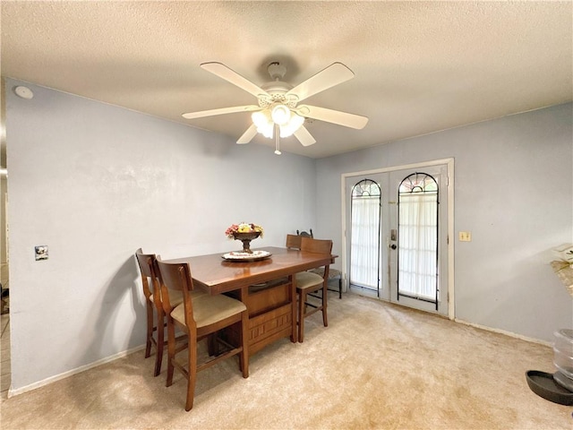 505 10th St, Bentonville, AR 72712 - dining area with a textured ceiling, light carpet, ceiling fan, and baseboards