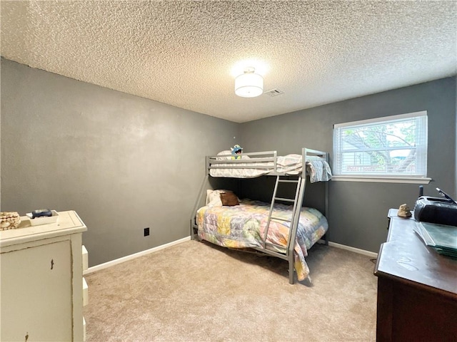 505 10th St, Bentonville, AR 72712 - bedroom featuring light carpet, a textured ceiling, and baseboards
