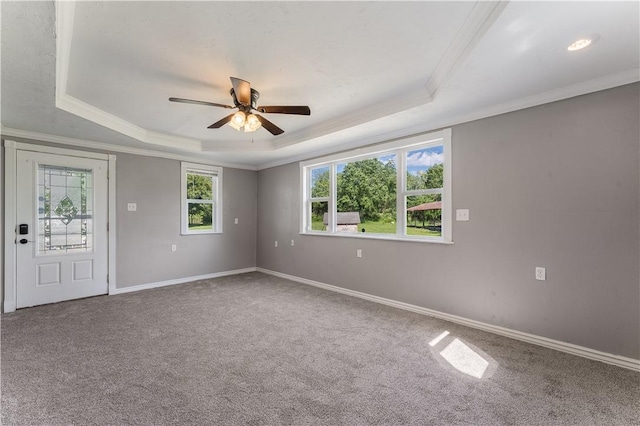125 E Orchard Ln, Rogers, AR 72756 - carpeted spare room with a tray ceiling, ornamental molding, ceiling fan, and baseboards