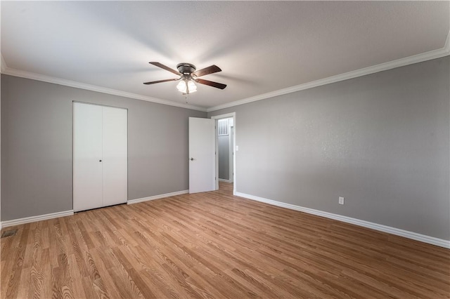 125 E Orchard Ln, Rogers, AR 72756 - unfurnished bedroom with wood finished floors, baseboards, ornamental molding, and a ceiling fan