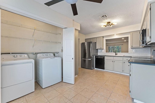 16 Eleanor Ln, Bella Vista, AR 72714 - clothes washing area with washer and clothes dryer, light tile patterned flooring, a ceiling fan, and a textured ceiling