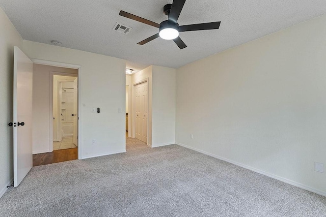 16 Eleanor Ln, Bella Vista, AR 72714 - unfurnished bedroom with carpet flooring, a textured ceiling, baseboards, and ceiling fan