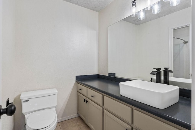 16 Eleanor Ln, Bella Vista, AR 72714 - bathroom with vanity, toilet, a textured ceiling, tile patterned floors, and baseboards