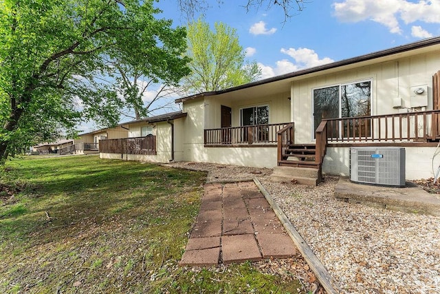 16 Eleanor Ln, Bella Vista, AR 72714 - rear view of house featuring cooling unit and a wooden deck