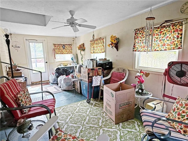 1711 W Cline Rd, Clarksville, AR 72830 - living area with a ceiling fan and concrete floors