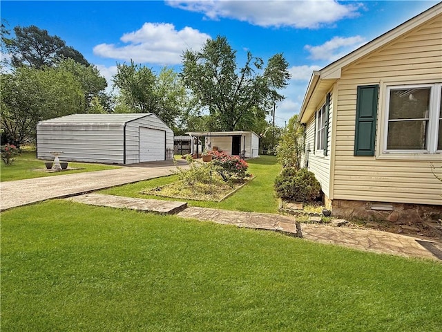 1711 W Cline Rd, Clarksville, AR 72830 - view of grassy yard with an outdoor structure, a garage, and driveway