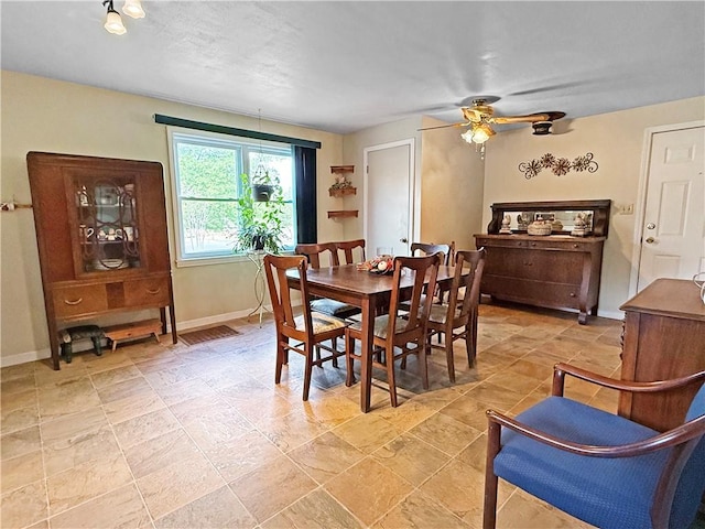 1711 W Cline Rd, Clarksville, AR 72830 - dining space with a ceiling fan and baseboards