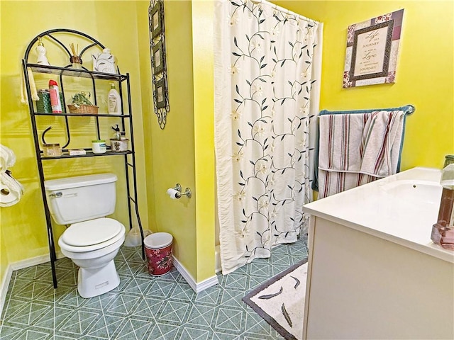 1711 W Cline Rd, Clarksville, AR 72830 - bathroom with a stall shower, toilet, baseboards, and a sink