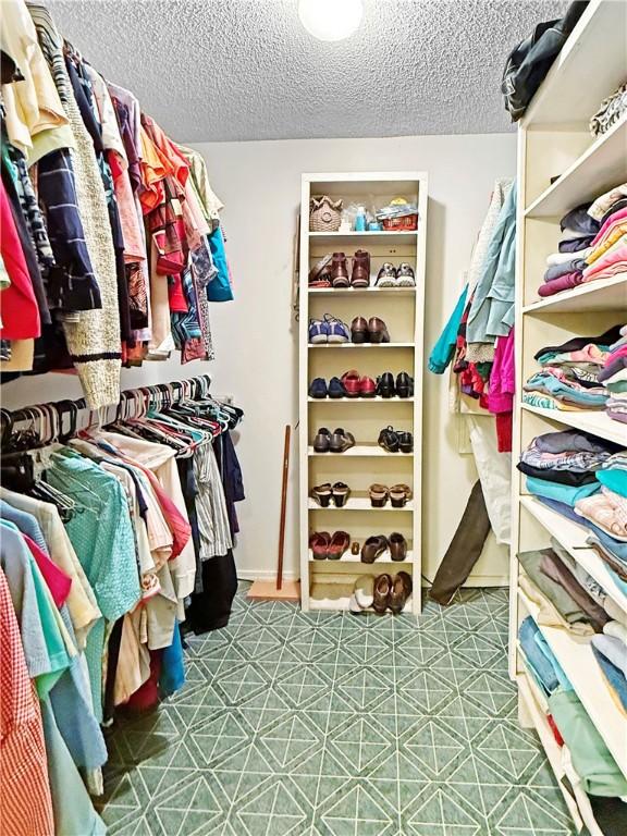 1711 W Cline Rd, Clarksville, AR 72830 - spacious closet with tile patterned floors