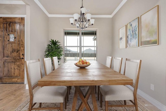 506 Hindman Dr, Prairie Grove, AR 72753 - dining space featuring a chandelier, light wood-type flooring, crown molding, and baseboards