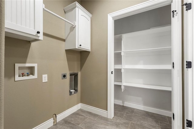 506 Hindman Dr, Prairie Grove, AR 72753 - laundry area featuring hookup for a washing machine, hookup for an electric dryer, baseboards, tile patterned floors, and cabinet space