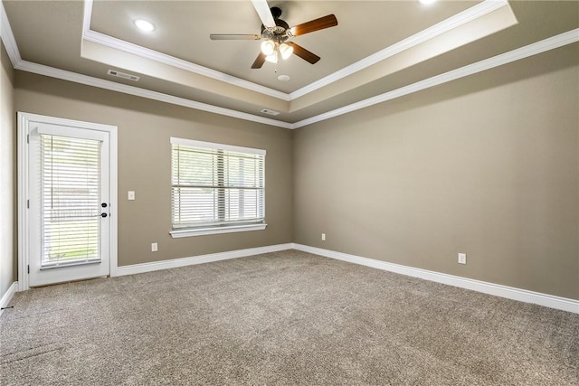 506 Hindman Dr, Prairie Grove, AR 72753 - spare room with a tray ceiling, carpet, ceiling fan, crown molding, and baseboards