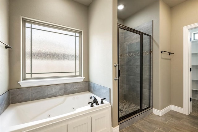506 Hindman Dr, Prairie Grove, AR 72753 - full bath with a stall shower, a jetted tub, and baseboards