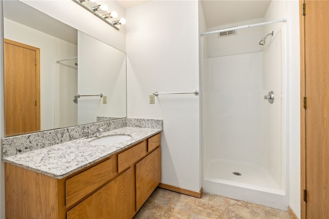 413 Columbia Pl, Lowell, AR 72745 - full bathroom featuring a shower, vanity, and baseboards