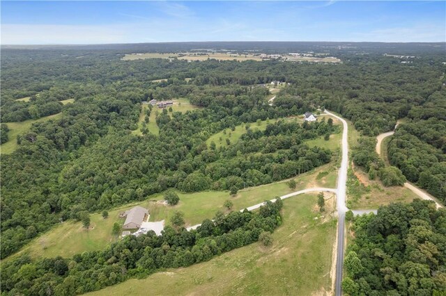 13812 Sunburst Ln, Gravette, AR 72736 - aerial view of property and surrounding area with a heavily wooded area