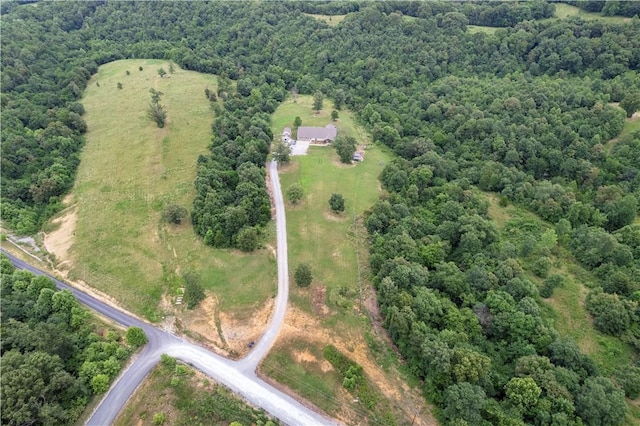 13812 Sunburst Ln, Gravette, AR 72736 - aerial view of property and surrounding area featuring a heavily wooded area