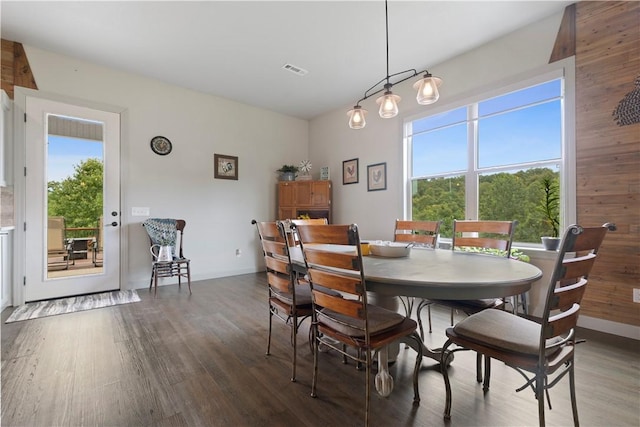 13812 Sunburst Ln, Gravette, AR 72736 - dining room featuring wood finished floors and baseboards