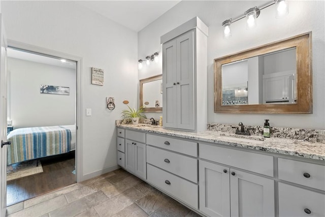 13812 Sunburst Ln, Gravette, AR 72736 - full bath featuring baseboards, double vanity, and ensuite bathroom