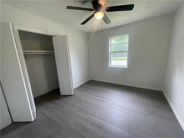 401 Walnut St, Clarksville, AR 72830 - unfurnished bedroom featuring baseboards, wood finished floors, and a closet