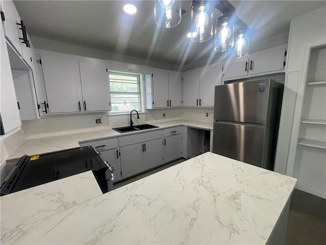 401 Walnut St, Clarksville, AR 72830 - kitchen featuring freestanding refrigerator, a sink, black electric range, and light stone countertops